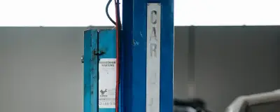 Cars on lifts in a workshop