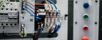Control panel with buttons and electrical components