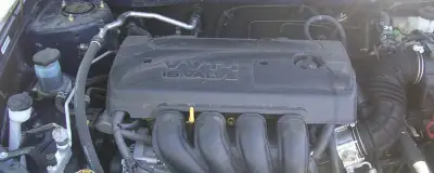 Toyota 1ZZ-FE engine compartment with oil fill cap visible
