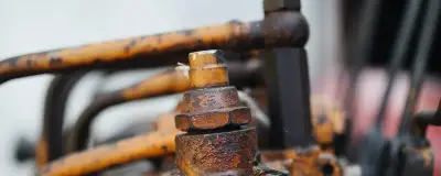 Weathered machinery with rust in a workshop