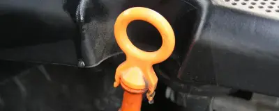 An oil dipstick in an engine