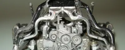 A serpentine belt on the front of an engine