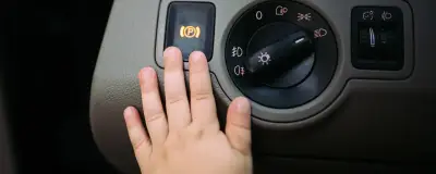Hand on a panel inside a car