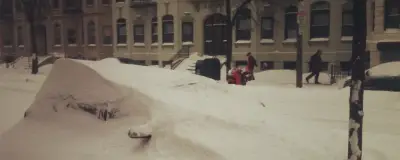 A snow-covered car